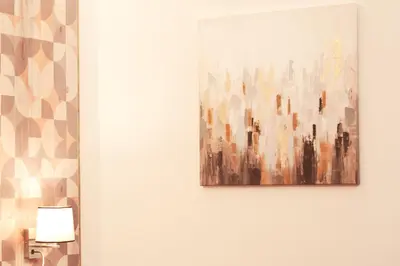 a painting of a city on a wall at SCIPIO92HOME in Rome