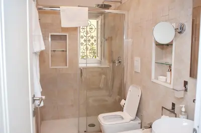 a bathroom with a shower and a toilet and a sink at SCIPIO92HOME in Rome