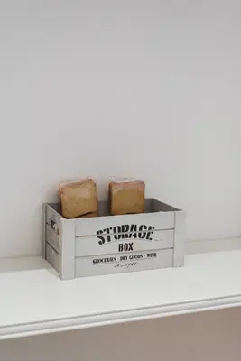 a box of bread sitting on top of a shelf at Lupa Luxury Apartment in Rome