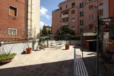 a courtyard in the middle of a building at Angelo Emo Flat in Rome