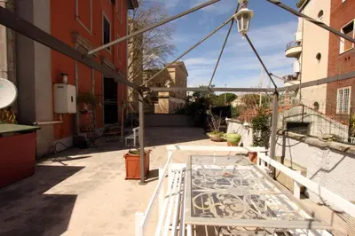 a balcony of a building with a metal railing at Angelo Emo Flat in Rome