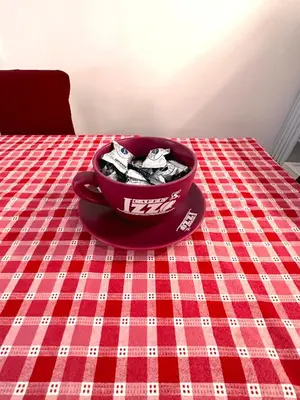a red bowl of food sitting on a table at Royal Domus Of Rome in Rome