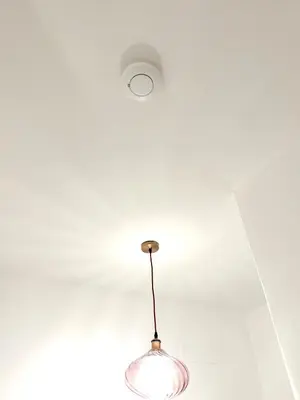 a light fixture hanging from the ceiling of a room at Royal Domus Of Rome in Rome