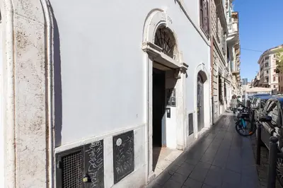 a street in a city with a white building at iFlat Shiny Loft in Trastevere in Rome