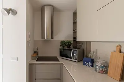 a kitchen with a microwave and a counter top at iFlat Shiny Loft in Trastevere in Rome