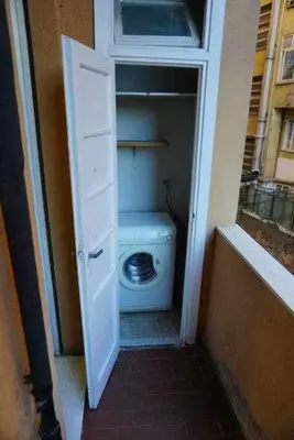 a bathroom with a white toilet in a room at Rhome Holiday Fornaci in Rome