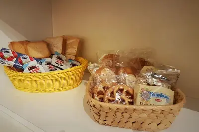 two baskets of bread sitting on top of a counter at Minohouse Vatican view in Rome