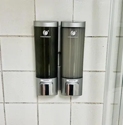 two coffeemakers sitting on a tile wall at ETERNA Trastevere Apartment in Rome