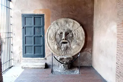a lion statue on the side of a building at ETERNA Trastevere Apartment in Rome