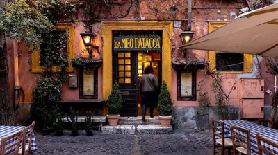a person standing in the door of a building at ETERNA Trastevere Apartment in Rome