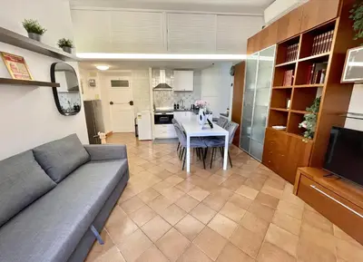 a living room with a couch and a table at ETERNA Trastevere Apartment in Rome