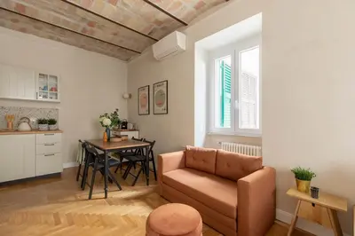 a living room with a couch and a table at iFlat Lovely Flat in Trastevere in Rome