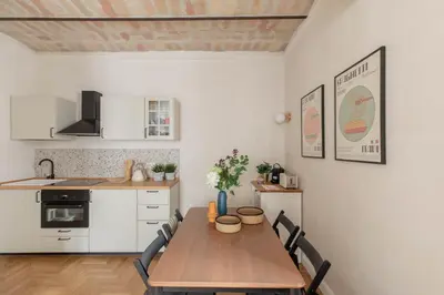 a kitchen with a wooden table in a room at iFlat Lovely Flat in Trastevere in Rome