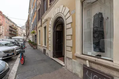 a bike parked on a sidewalk next to a building at iFlat The G Flat in Rome