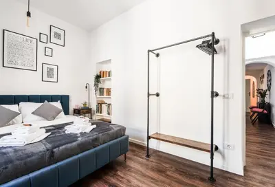 a bedroom with a bed and a glass door at Piacentino Homes Corso apartment in Rome