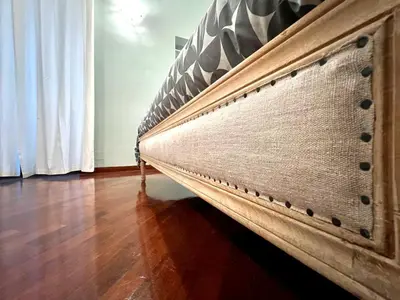 a bed in a room with a wooden floor at Inn Sistina Home in Rome
