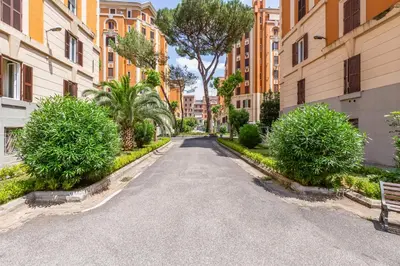 an empty street in a city with buildings at The Great Beauty - 2 double bedrooms & 2 bathrooms in Rome