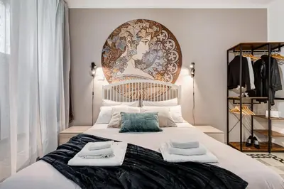 a bedroom with a large bed with towels on it at The Great Beauty - 2 double bedrooms & 2 bathrooms in Rome