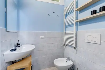 a bathroom with a sink and a toilet at The Great Beauty - 2 double bedrooms & 2 bathrooms in Rome