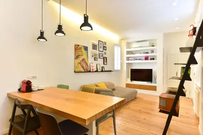 a living room with a table and a couch at Paolina Boutique Apartment Monti in Rome