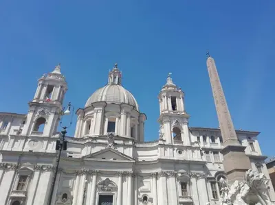 a building with a blue sky in the background at Fontanella Dream apartment in Rome