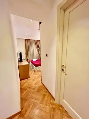 an open door to a room with a bedroom at Auditorium Maxxi luxury suite Roma in Rome