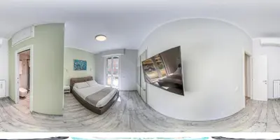a living room with a couch and a tv at Re di Roma Apartment in Rome