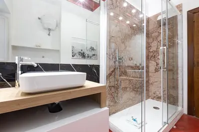 a bathroom with a sink and a shower at Amazing Art Déco Apartment Pantheon in Rome