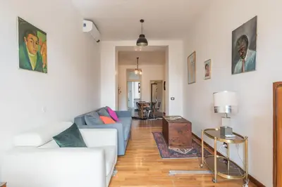 a living room with a couch and a table at Stylish Pigneto Apartment in Rome