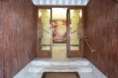 an empty hallway with a door in a brick wall at Residenza Lualdi in Rome