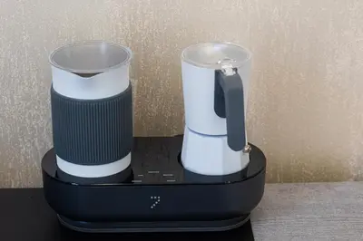 a black and white blender sitting on a table at KOSMO ROME Luxury in Rome