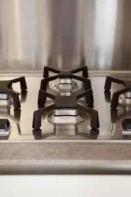 a stove top with three burners on top of it at Appartamento Trastevere & Porta Portese grande in Rome