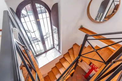 an overhead view of a staircase with a mirror at Trastevere Vintage Artistic Loft in Rome