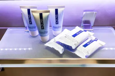 a shelf with two bottles of lotion and toothpaste at R.C. Cappellari Loft Campo de' Fiori in Rome