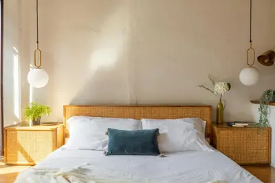 a bedroom with a bed with a blue pillow on it at iFlat Lovely flat in Navona in Rome