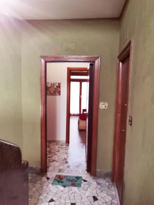 a hallway with a door leading to a room at Appartamento per Turisti e Famiglie Roma in Rome