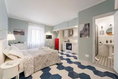 a room with a bed and a bathroom at The small nest at Coliseum in Rome