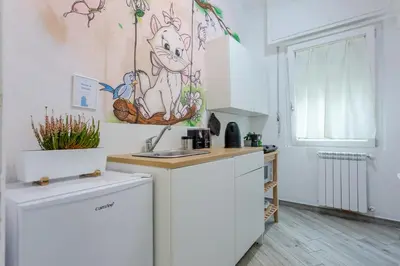 a kitchen with a sink and a counter top at Holiday Homes Rome - Portuense 21 - Family Studio in Rome