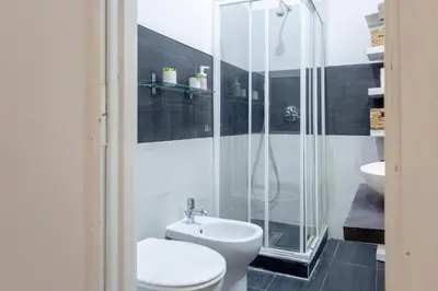a bathroom with a shower and a toilet and a sink at Holiday Homes Rome - Portuense 21 - Family Studio in Rome