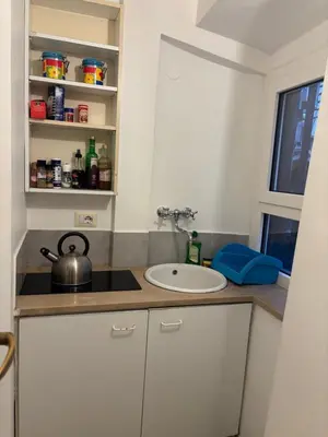 a small kitchen with a sink and a sink at Casa Uberto in Rome