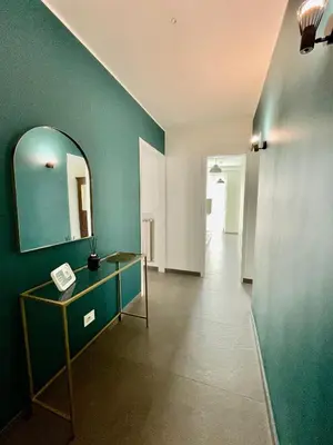 a room with a vanity and a mirror and a hallway at PRIVATEHOUSEINROME in Rome