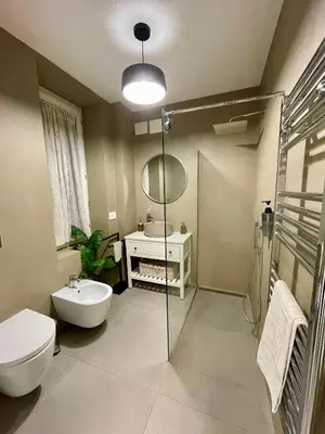 a bathroom with a sink and a toilet and a shower at PRIVATEHOUSEINROME in Rome
