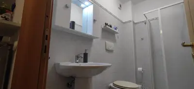 a bathroom with a sink and a toilet and a shower at l'altra casetta dei Quintili in Rome