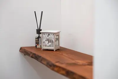 a white box sitting on a wooden shelf at Emperooms Guest House in Rome