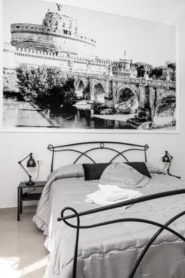 a bedroom with a bed with a picture of a cruise ship at Emperooms Guest House in Rome