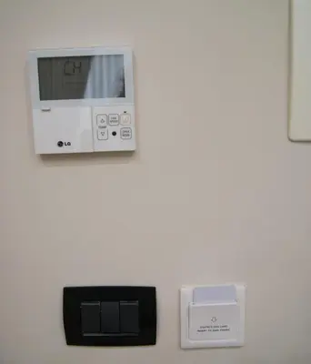 a clock on a wall next to a scale at Esposizione Boutique in Rome