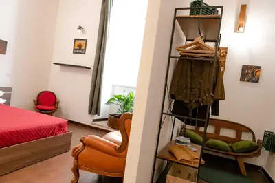 a room with a bed and a closet at MyWay Colosseo Apartment in Rome