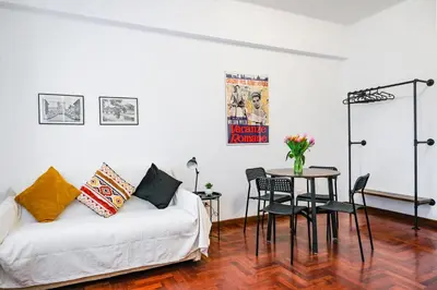 a room with a bed and a table and chairs at St. Peter Vatican Home in Rome