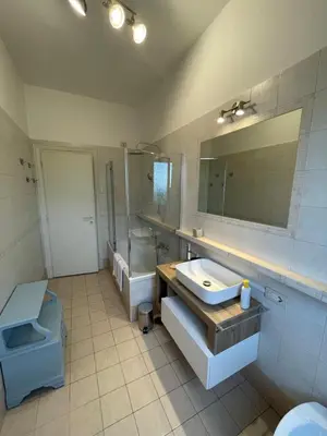 a bathroom with a sink and a toilet and a mirror at Gregorio VII Vatican House in Rome