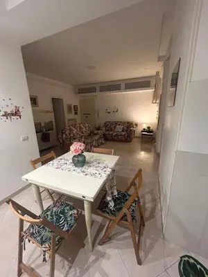 a kitchen with a table and chairs in a room at Home in Trastevere Testaccio in Rome